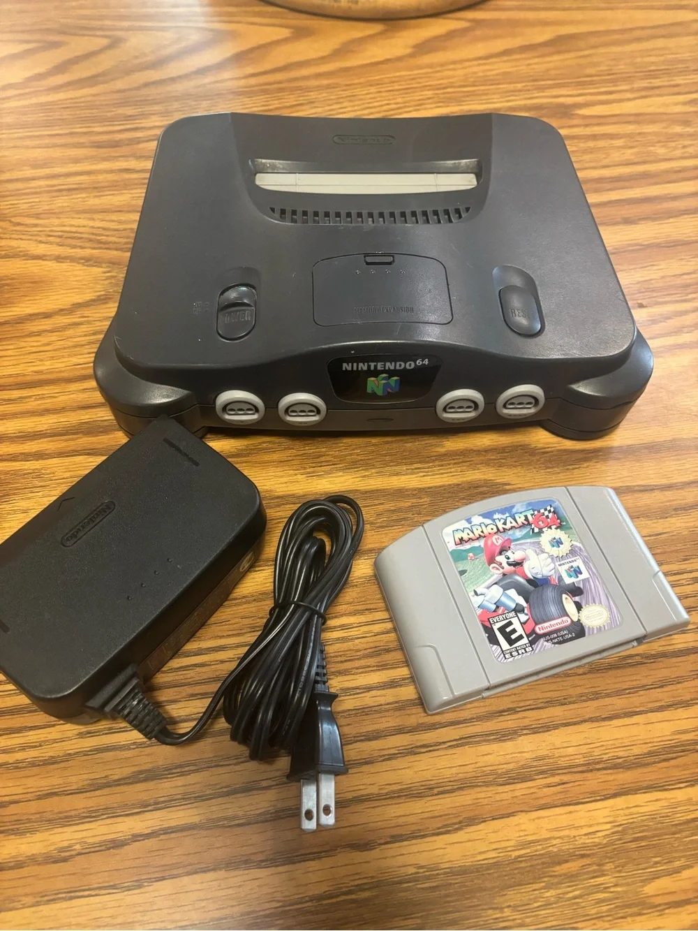 Nintendo N64 Console with Gray Mario Kart 64 Cartridge and Black Power Adapter